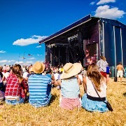 People at farm enjoying a concert.