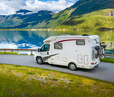 RV on road near lake