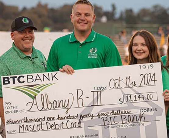 Albany R-III receiving a check from BTC