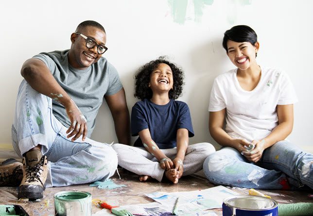 Three people laughing.