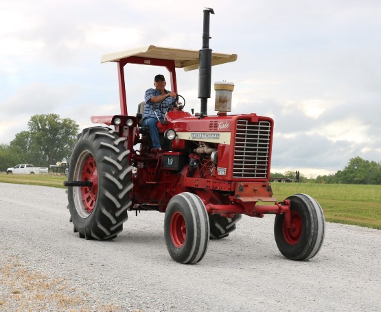 a farmer on his old international tractor