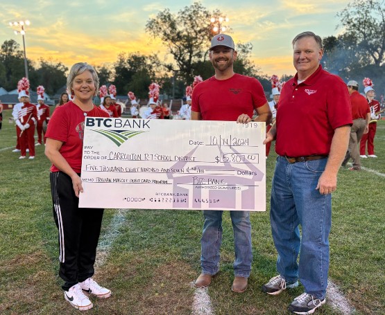 BTC presenting a check for the Carrollton Mascot Card Donation