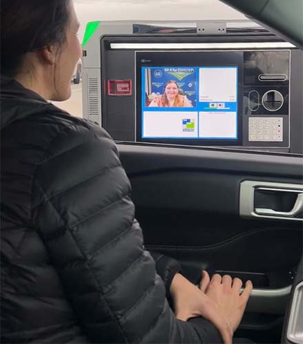 Woman using an ITM drive up.