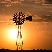 The sun setting behind a windmill in Missouri