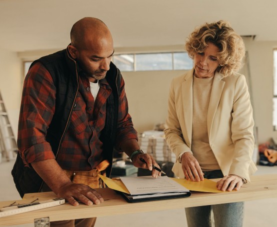 a contractor and client reviewing plans