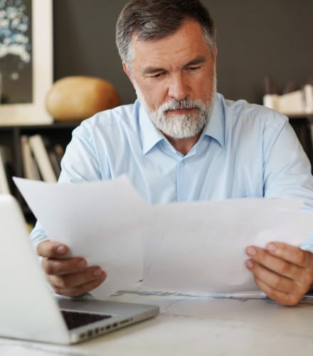 a man reviewing paperwork