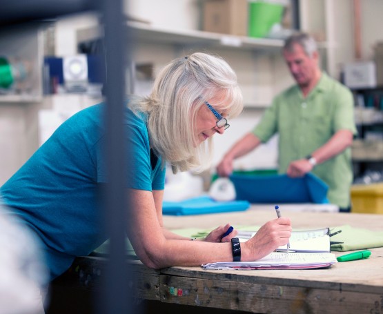 A business owner reviews customer orders