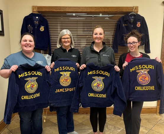 People posing with Missouri FFA jackets