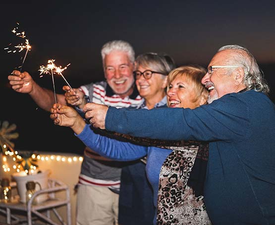 Mature group of 4 with sparklers.