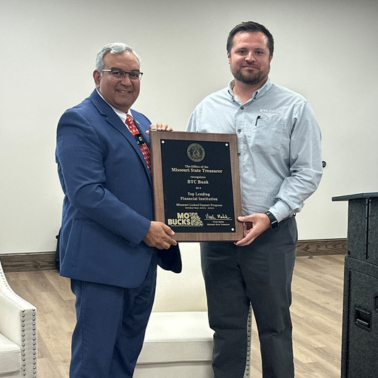 Missouri State Treasurer Vivek Malek presented BTC Bank South Region President Jon Fish with an award for MOBUCK$ Program leadership