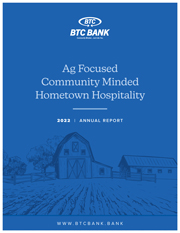 BTC Bank 2022 Annual Report Cover artwork. Royal Blue background with a dark blue illustrated farm with the words "Ag Focused, Community Minded, Hometown Hospitality" typed.