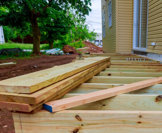 exterior of a home with a new deck being built showing wood planks