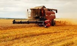 Farm equipment harvesting a field in Missouri.